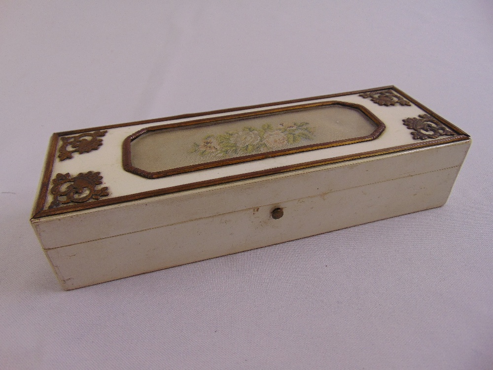 A 19th century French rectangular wooden box the hinged cover embroidered with flowers