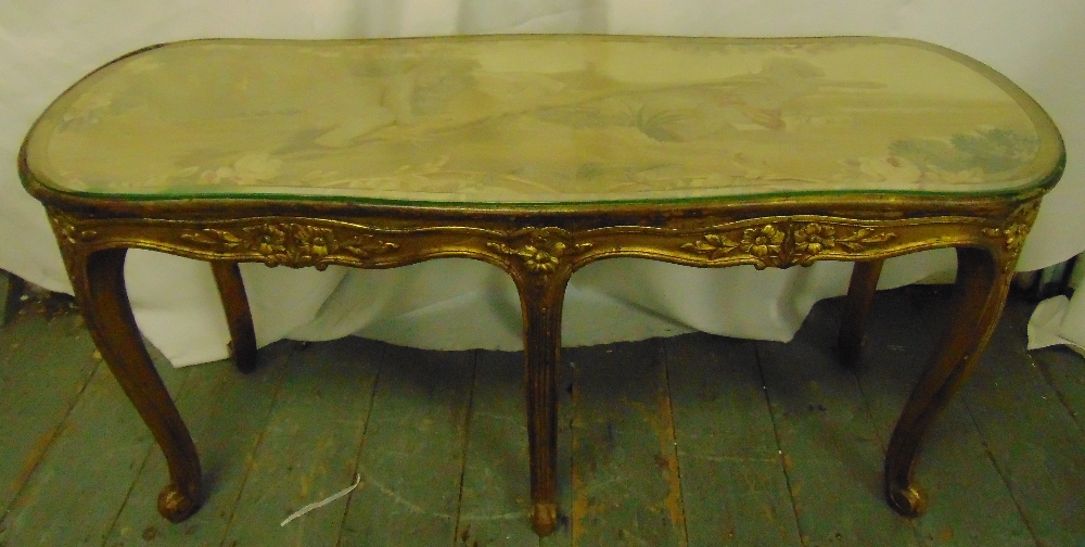 A salon table rounded rectangular carved gilt wood sides and cabriole legs with tapestry top