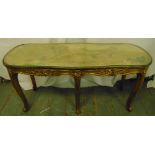 A salon table rounded rectangular carved gilt wood sides and cabriole legs with tapestry top
