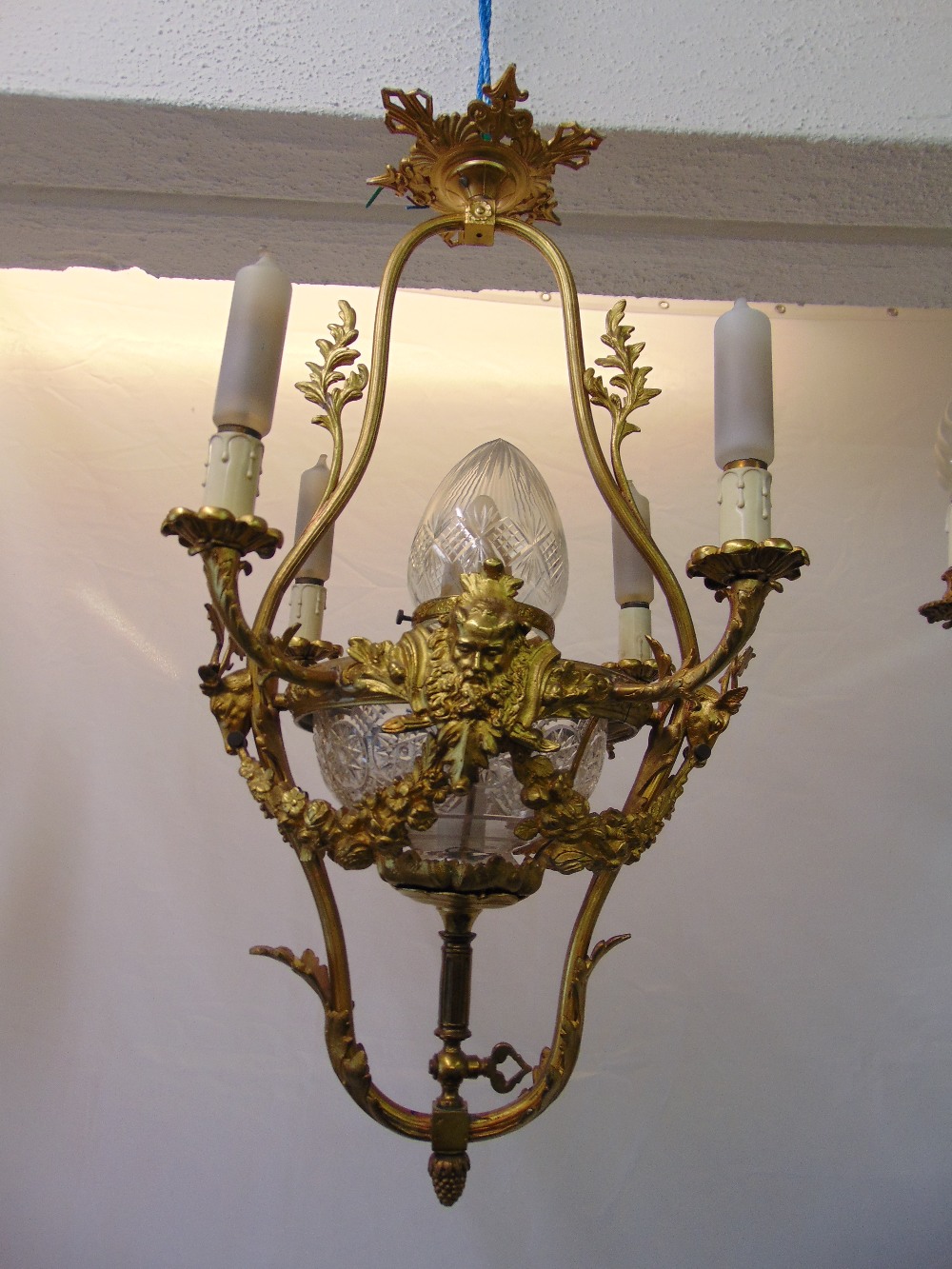 A Victorian gilded metal four branch chandelier with cut glass central bowl