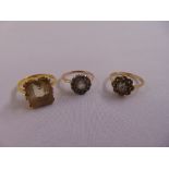 Three yellow gold rings set with various stones, approx total weight 8.7g