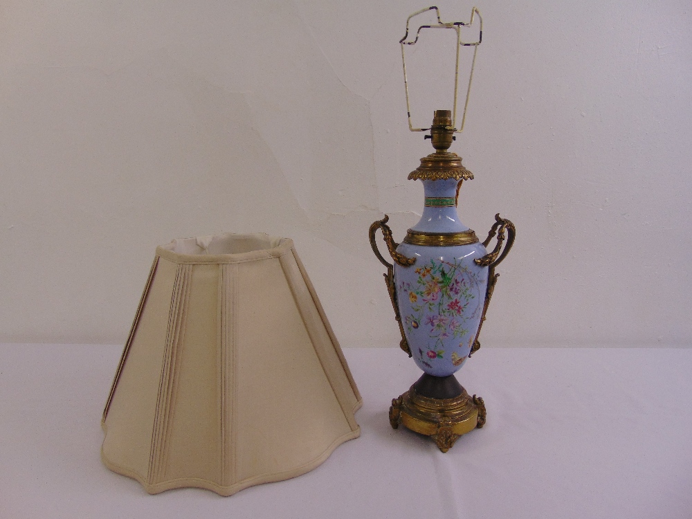 A late 19th century French ormolu mounted blue ceramic table lamp, decorated with hand painted