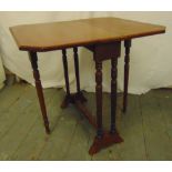 A 19th century rectangular mahogany Sutherland table with turned cylindrical supports