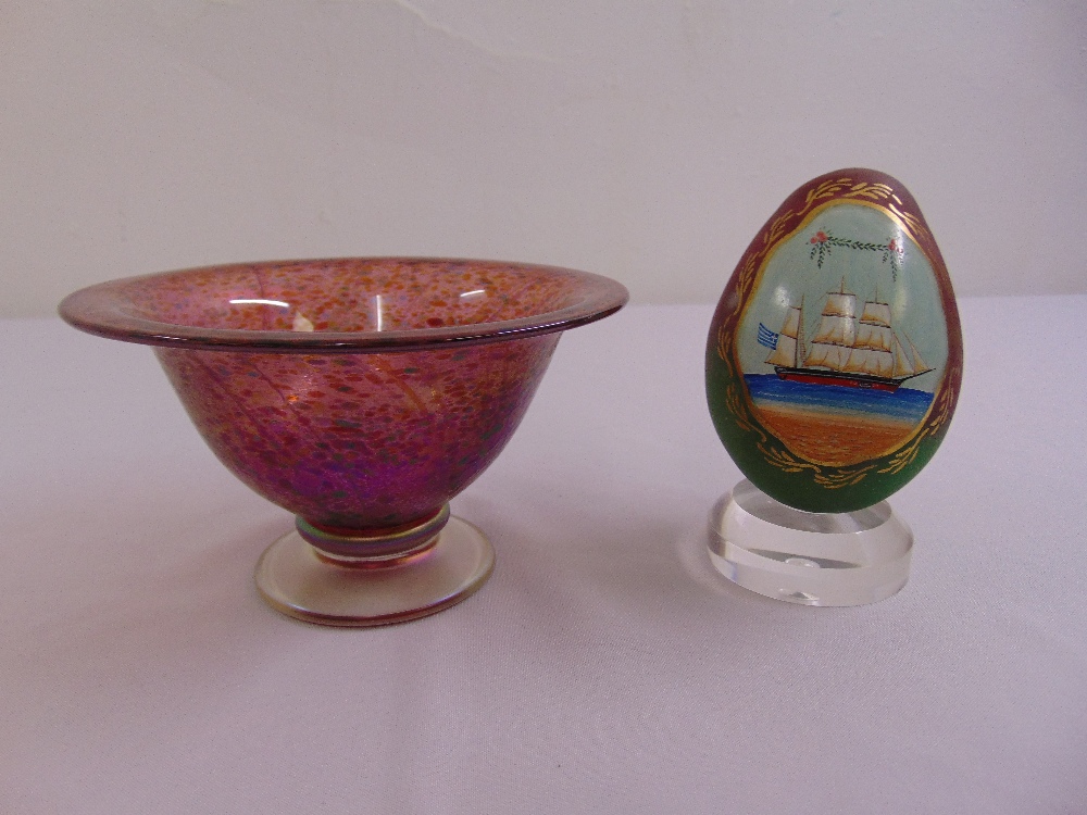 An art glass bowl and a hand-painted Russian egg shaped glass on a perspex stand