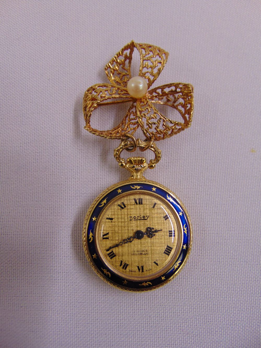 Dorley ladies brooch watch with decorative enamel bezel