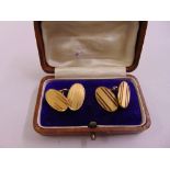 A pair of 9ct gold engine turned cufflinks, approx 7.0g