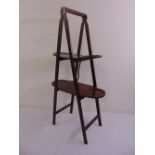 A mahogany A frame double sided plate stand