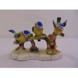 Royal Doulton figural group of birds on a branch, marks to the base