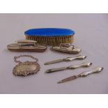 A quantity of silver to include a manicure set and an enamel silver clothes brush (7)