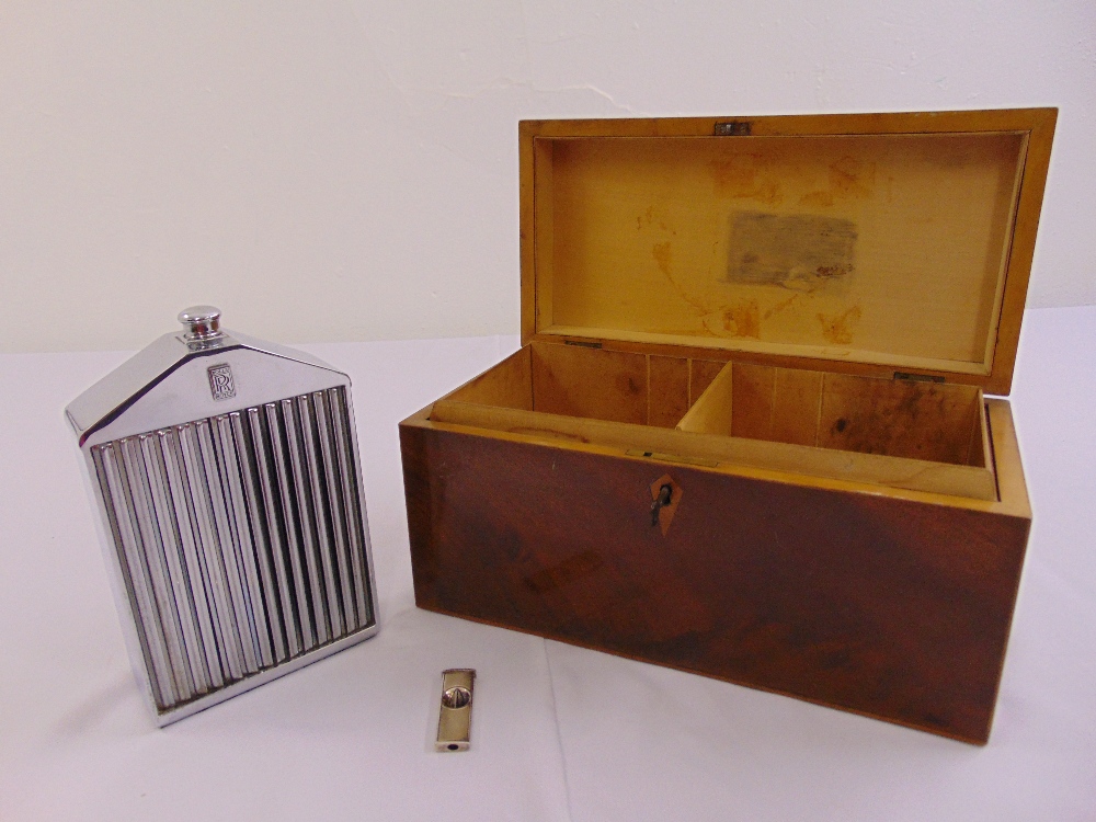 A Rolls Royce chrome decanter in the form of a car grill, a rectangular cigar humidor and a cigar