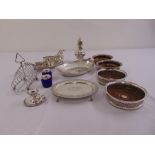 A quantity of silver plate to include coasters, a toast rack, a card tray, a dish and an