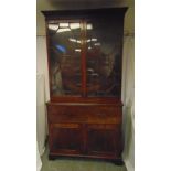 A 19th century rectangular mahogany secretaire bookcase, with hinged glazed doors above four drawers