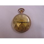 A gold plated open face pocket watch with Arabic numerals