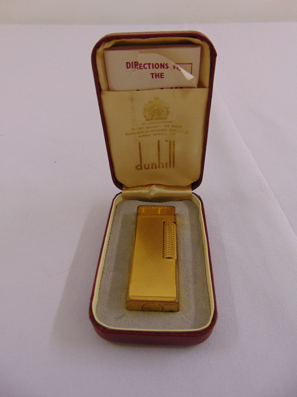 Dunhill gold plated engine turned cigarette lighter in original fitted case