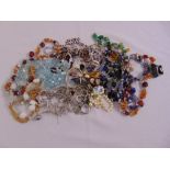 A quantity of costume jewellery to include necklaces, bracelets, earrings and rings