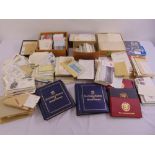 A quantity of GB and foreign first day covers and two albums of 22 carat replicas of British stamps