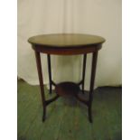 An Edwardian mahogany circular occasional table on tapering rectangular legs