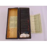 A quantity of cased magic lantern photographic glass slides by George Washington Wilson titled A Day
