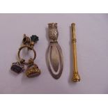 Three fob seals, a watch key, a silver bookmark and yellow metal propelling pencil