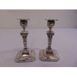 A pair of late Victorian silver neo-classical style table candlesticks, Sheffield 1901 by James