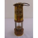 A miners brass Davy lamp by E. Thomas and Williams Ltd, no 229510