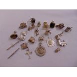 A quantity of hallmarked silver charms, seals and pendants (22)