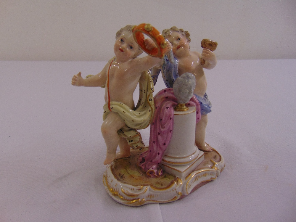 Meissen figural group of putti symbolising music and the arts, marks to the base