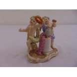 Meissen figural group of putti symbolising music and the arts, marks to the base