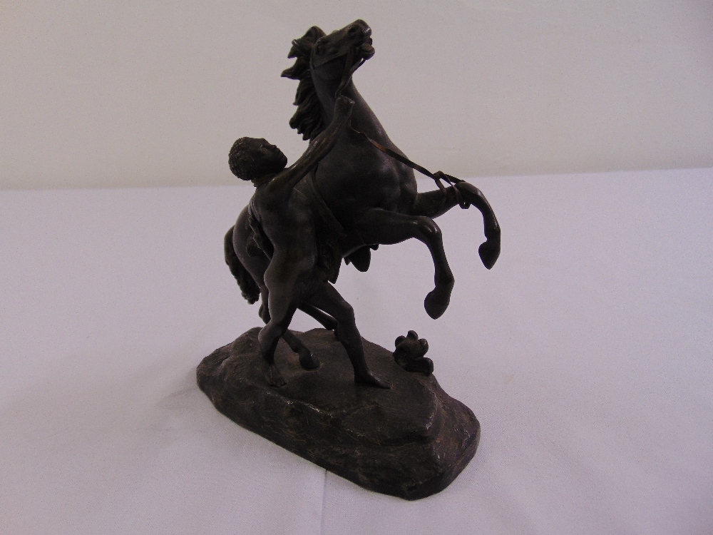 A bronze of a Marly horse and tamer in the style of Coustou, 18cm(h)