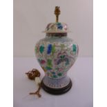 A Chinese porcelain baluster vase decorated with flowers and butterflies, later converted to a table