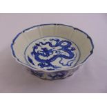 A Chinese blue and white dish decorated with dragons