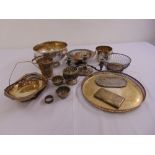 A quantity of silver plate to include a punch bowl, cake dishes, a circular tray and a cigarette