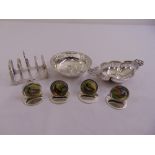 A quantity of silver to include two dishes with pierced sides, a toast rack, four place holders