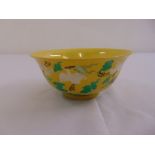 A Chinese yellow ground rice bowl decorated with birds and flowers