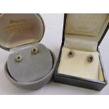 A cased pair of 18ct gold emerald and diamond cluster earrings, and a cased pair of 18ct gold