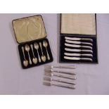 A cased set of silver hallmarked teaspoons, a cased set of silver hallmarked butter knives, and five