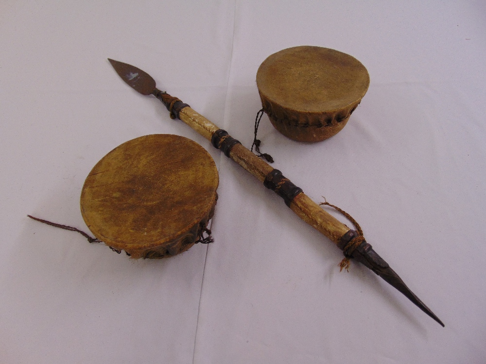 Two African ceremonial drums and a ceremonial spear