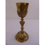 A 19th century continental silver gilt chalice, the knopped stem chased with scrolls acanthus leaves