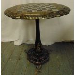 A Victorian ebonised papier mache oval tilt-top games table by Jenners & Bettridge inlaid with