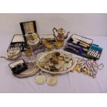 A quantity of silver plate to include flatware, teapots, trays, toast racks and cased sets of