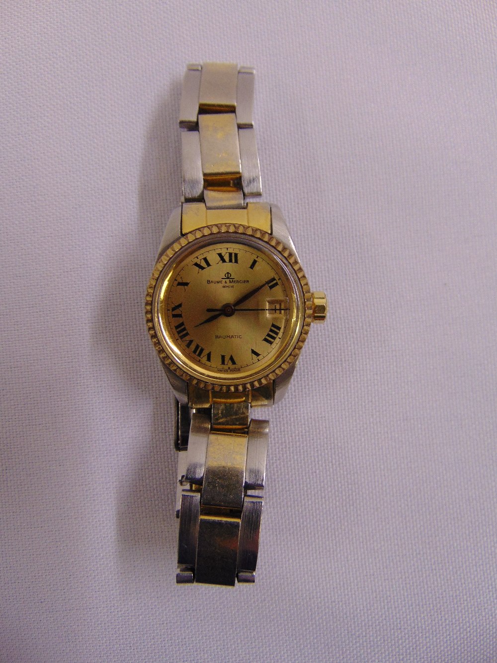 A Baum Mercier ladies steel and gold plated Baumatic wristwatch