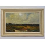 A framed oil on canvas landscape of cattle by a stream under a cloud sky, 25.5 x 45.5cm