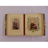 A leather bound Victorian photograph album with original photographs