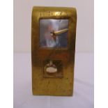 A novelty U shaped brass mantle clock with detachable pendulum