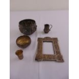 A quantity of Indian white metal to include dishes, a photograph frame, cups and a jug (5)