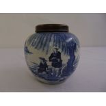 A Chinese blue and white ginger jar with detachable hardwood cover decorated with fisherman by a