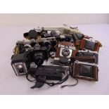 A quantity of photographic equipment to include cameras, lenses and accessories