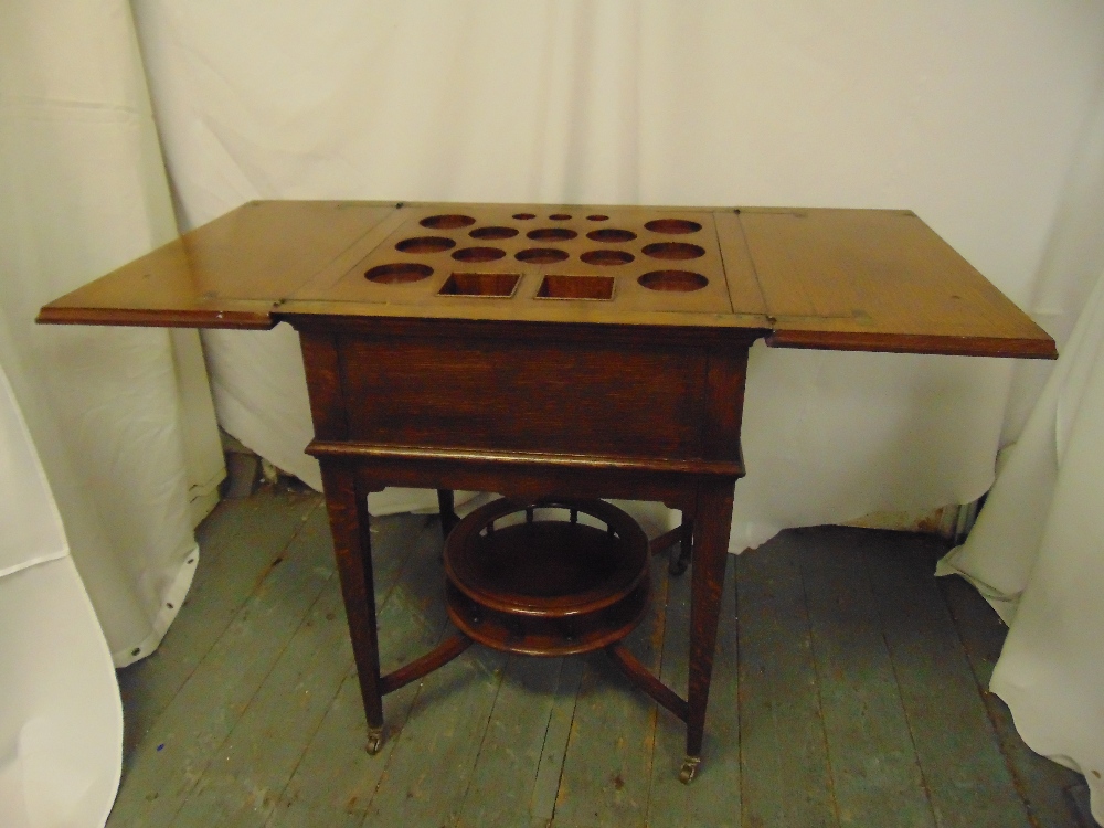 A mahogany rectangular occasional table cum drinks stand, on four tapering rectangular legs