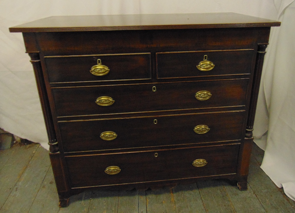 A 19th century rectangular mahogany chest of drawers with brass swing handles on four bracket feet