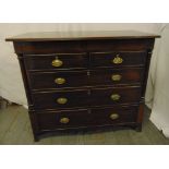 A 19th century rectangular mahogany chest of drawers with brass swing handles on four bracket feet